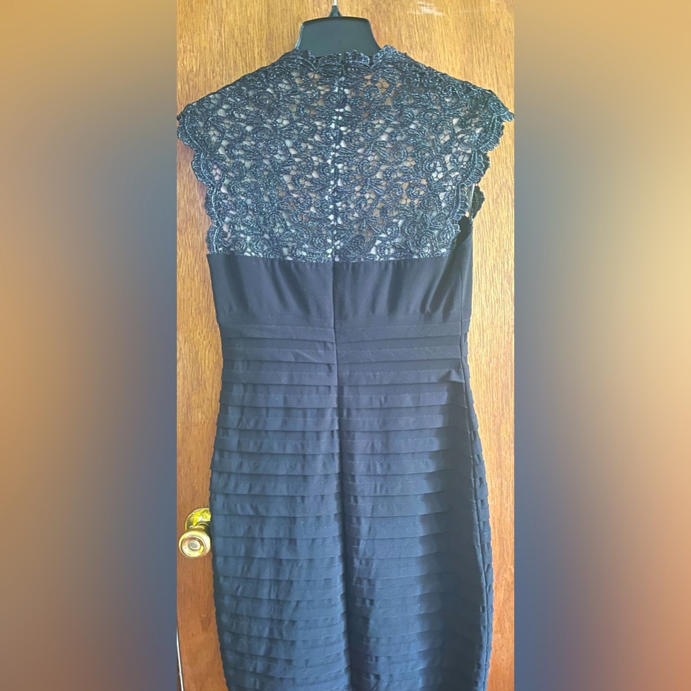 Black with lace detail. Cache size 8. Good condition